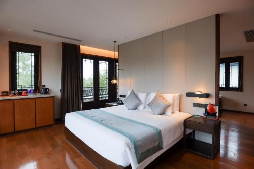 Imagen de la habitación del Hotel Yuyao Yangmingguan. Foto 17