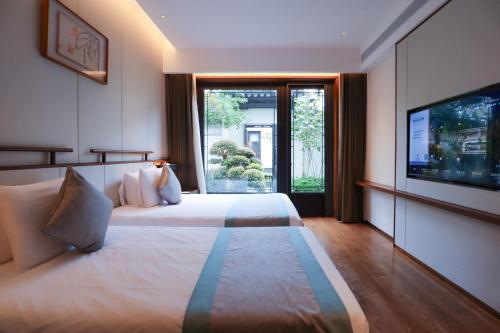 Imagen de la habitación del Hotel Yuyao Yangmingguan. Foto 18