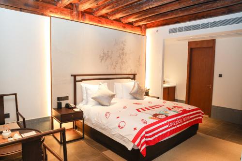 Imagen de la habitación del Hotel Yuyao Yangmingguan. Foto 20