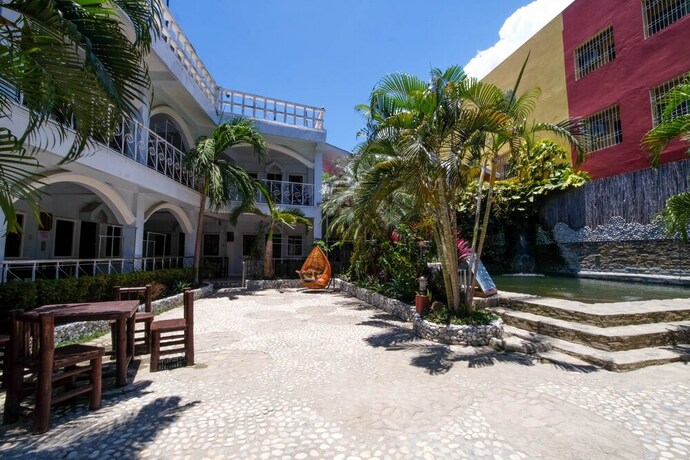Imagen de los exteriores del Hotel ZEN Rooms White Beach. Foto 14