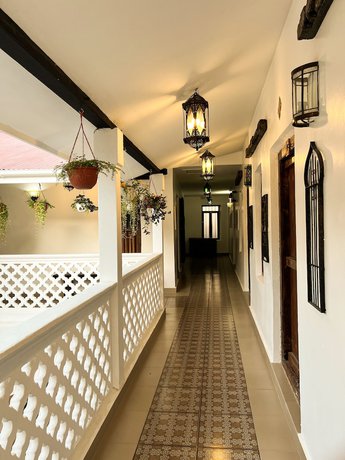 Imagen de la habitación del Hotel Zanzi House. Foto 8