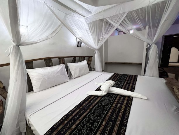 Imagen de la habitación del Hotel Zanzi House. Foto 9