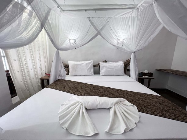 Imagen de la habitación del Hotel Zanzi House. Foto 10