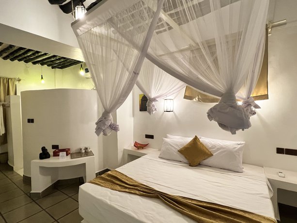 Imagen de la habitación del Hotel Zanzi House. Foto 15