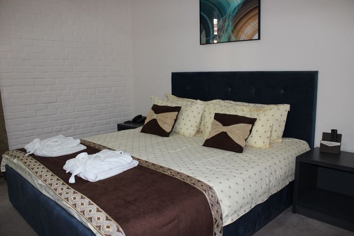 Imagen de la habitación del Hotel Zarafshan Grand Hotel. Foto 4