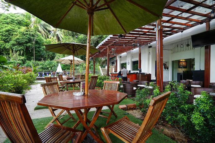 Imagen de los exteriores del Hotel Zen Rooms Changi Village. Foto 7