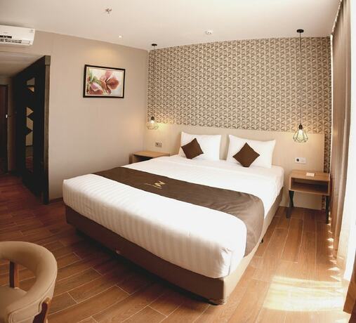 Imagen de la habitación del Hotel Zenith Premiere Baubau. Foto 20