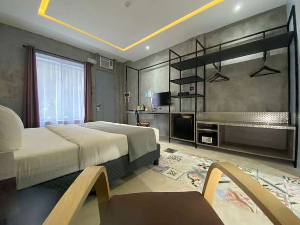 Imagen de la habitación del Hotel Zenvea Hotel Coron. Foto 19