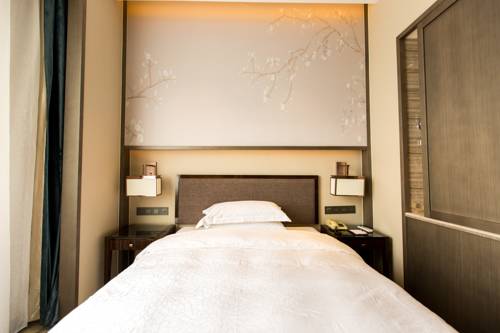 Imagen de la habitación del Hotel Zhangjiagang Guomao, Zhangjiagang. Foto 6