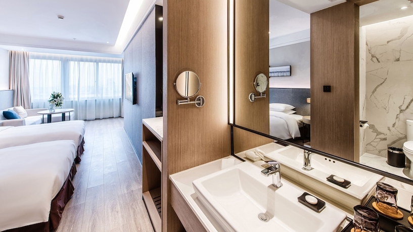 Imagen de la habitación del Hotel Zhangjiagang Suning Auraya. Foto 15