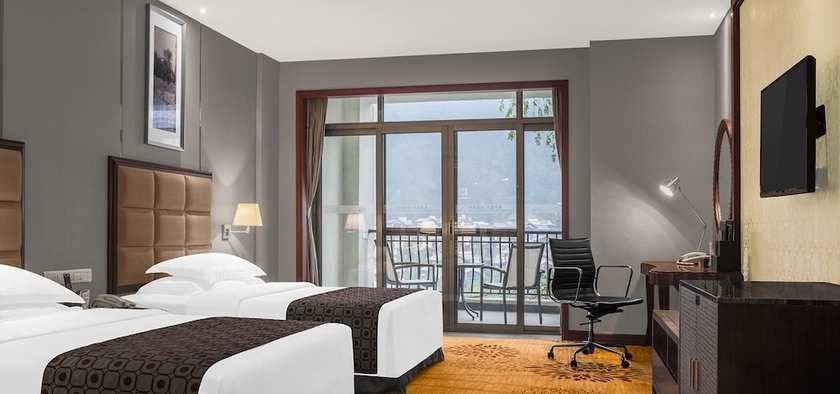 Imagen de la habitación del Hotel Zhangjiajie Country Garden Phoenix Suites. Foto 7