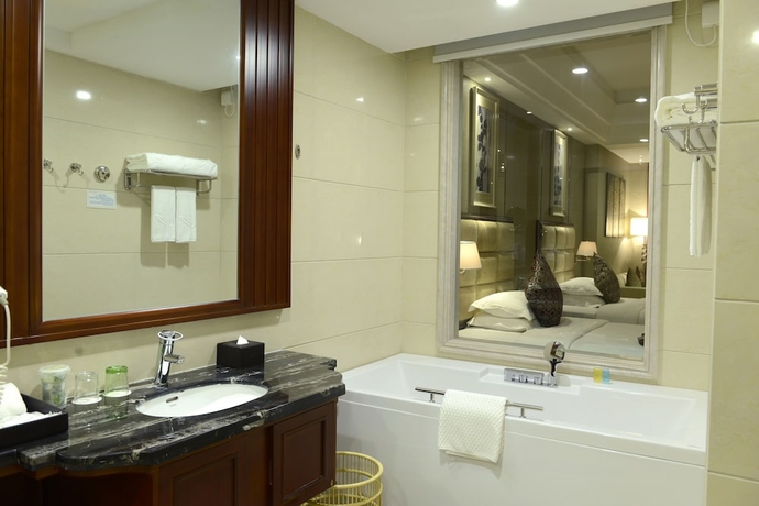 Imagen de la habitación del Hotel Zhangjiajie Country Garden Phoenix Suites. Foto 13