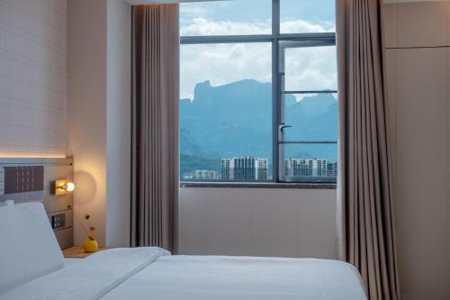 Imagen de la habitación del Hotel Zhangjiajie Homeinn Plus. Foto 18
