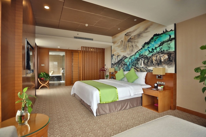 Imagen de la habitación del Hotel Zhangjiajie Huatian. Foto 11