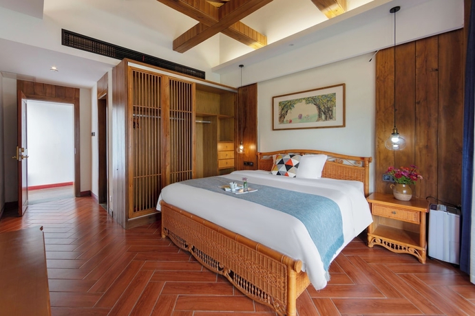 Imagen de la habitación del Hotel Zhangjiajie Ldyllic PondsideTimber Lodge. Foto 5