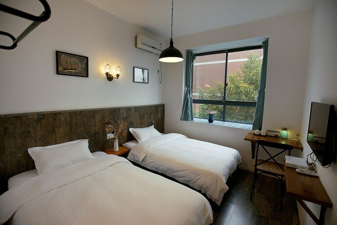 Imagen de la habitación del Hotel Zhangjiajie MINI Inn. Foto 12