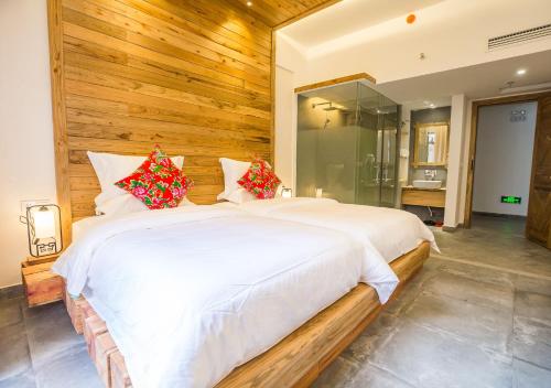 Imagen de la habitación del Hotel Zhangjiajie Maosao Inn. Foto 6