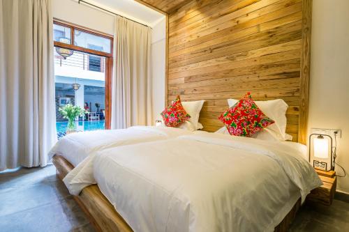 Imagen de la habitación del Hotel Zhangjiajie Maosao Inn. Foto 7