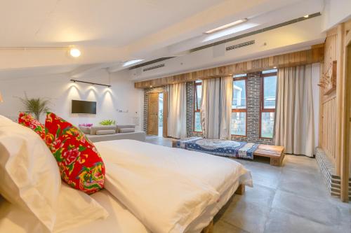 Imagen de la habitación del Hotel Zhangjiajie Maosao Inn. Foto 8