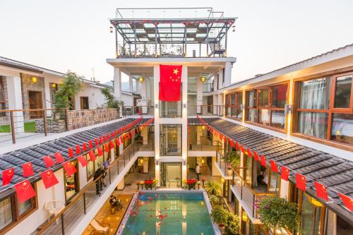 Imagen de la habitación del Hotel Zhangjiajie Maosao Inn. Foto 9