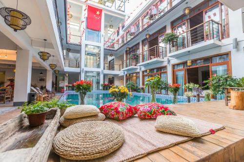 Imagen de la habitación del Hotel Zhangjiajie Maosao Inn. Foto 10