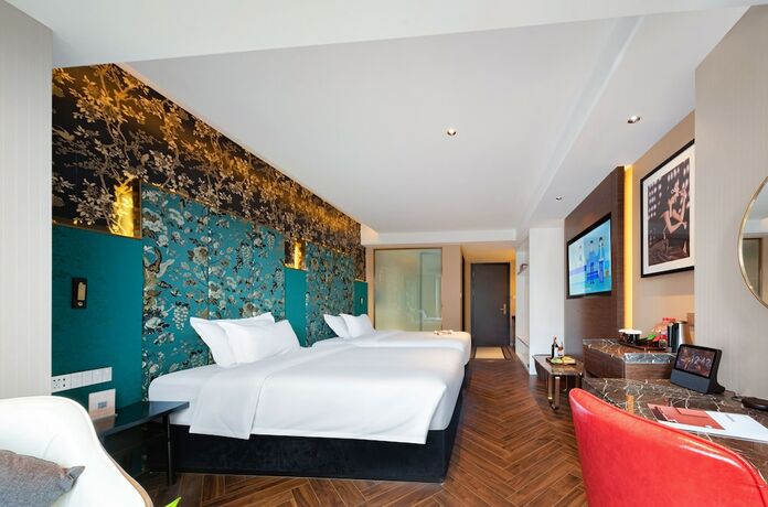 Imagen de la habitación del Hotel Zhangjiajie Metropolo. Foto 14