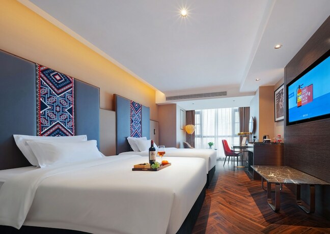 Imagen de la habitación del Hotel Zhangjiajie Metropolo. Foto 17