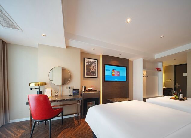 Imagen de la habitación del Hotel Zhangjiajie Metropolo. Foto 18