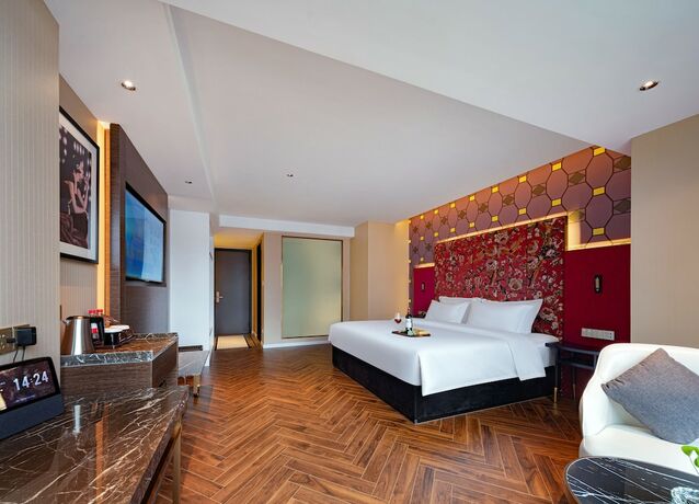 Imagen de la habitación del Hotel Zhangjiajie Metropolo. Foto 22