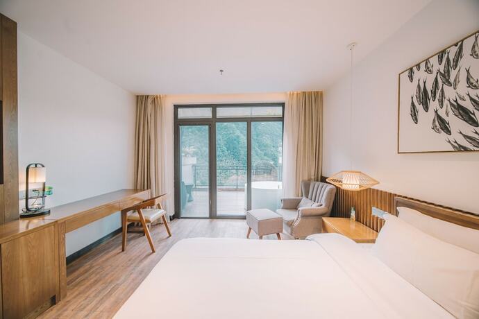 Imagen de la habitación del Hotel Zhangjiajie National Park Nvue Resorts. Foto 12
