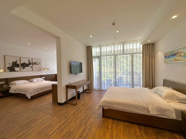 Imagen de la habitación del Hotel Zhangjiajie National Park Nvue Resorts. Foto 18