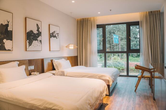 Imagen de la habitación del Hotel Zhangjiajie National Park Nvue Resorts. Foto 19