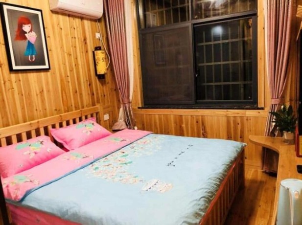 Imagen de la habitación del Hotel Zhangjiajie Yunqi Inn. Foto 6