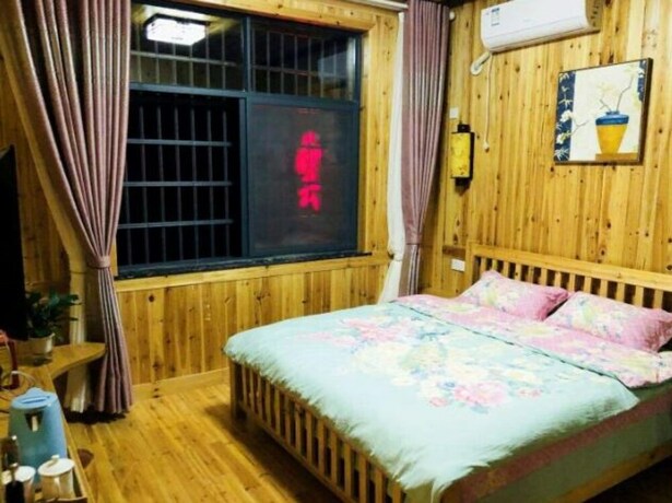 Imagen de la habitación del Hotel Zhangjiajie Yunqi Inn. Foto 7