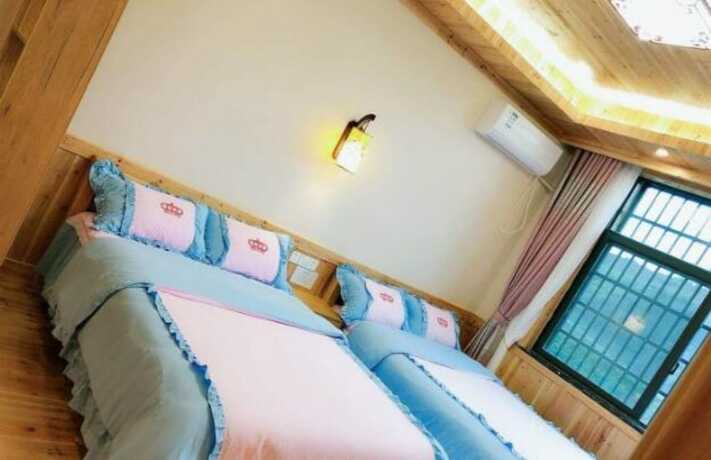 Imagen de la habitación del Hotel Zhangjiajie Yunqi Inn. Foto 8