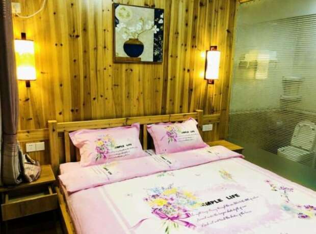 Imagen de la habitación del Hotel Zhangjiajie Yunqi Inn. Foto 9