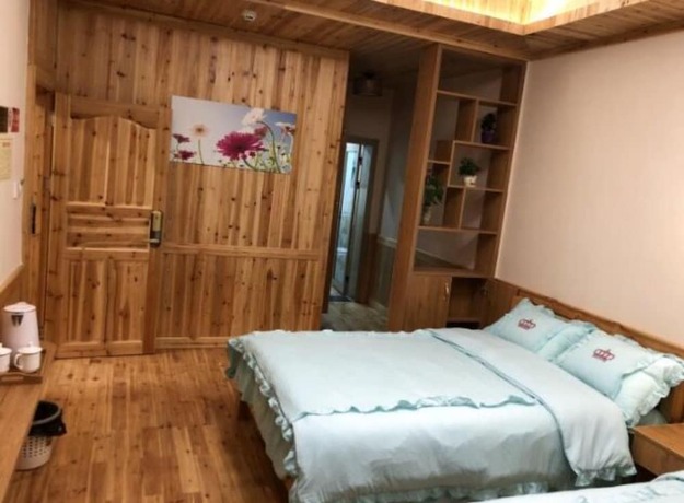 Imagen de la habitación del Hotel Zhangjiajie Yunqi Inn. Foto 10