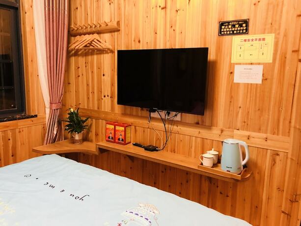 Imagen de la habitación del Hotel Zhangjiajie Yunqi Inn. Foto 12