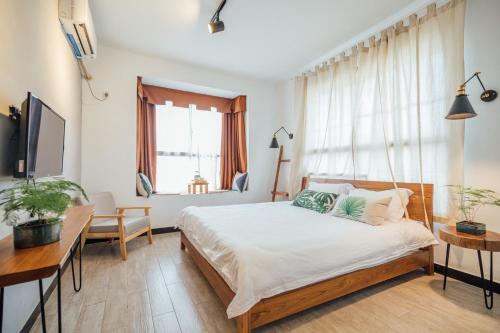Imagen de la habitación del Hotel Zhangjiajie Zhijue Art. Foto 8