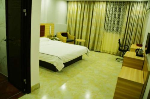 Imagen de la habitación del Hotel Zhanjiang Dongjian Xiaochengzhixing. Foto 10