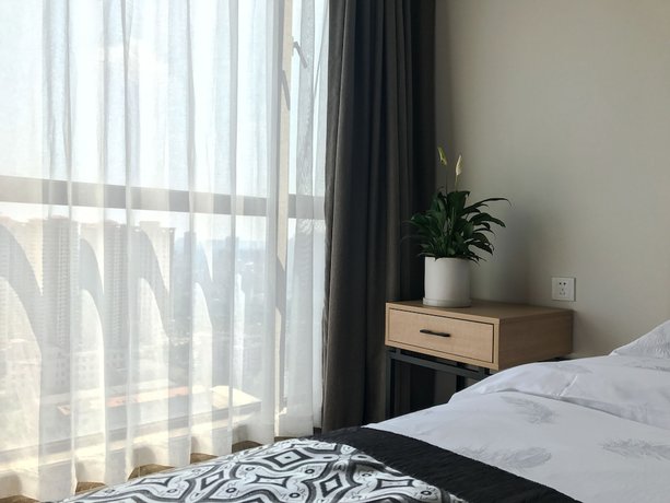 Imagen de la habitación del Hotel Zhanjiang Yuntu Apartment. Foto 12