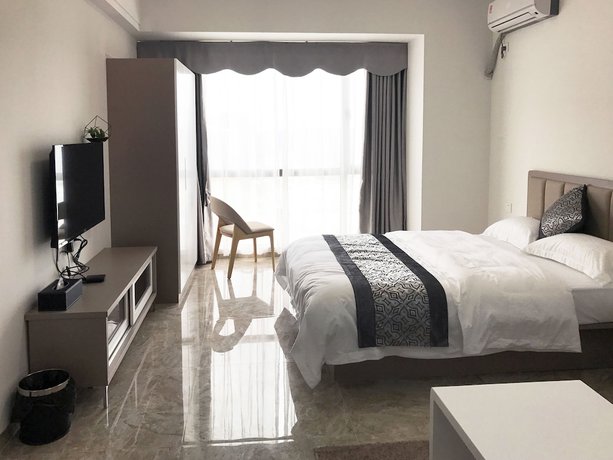 Imagen de la habitación del Hotel Zhanjiang Yuntu Apartment. Foto 18