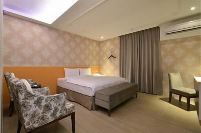 Imagen de la habitación del Hotel Zhaody. Foto 16