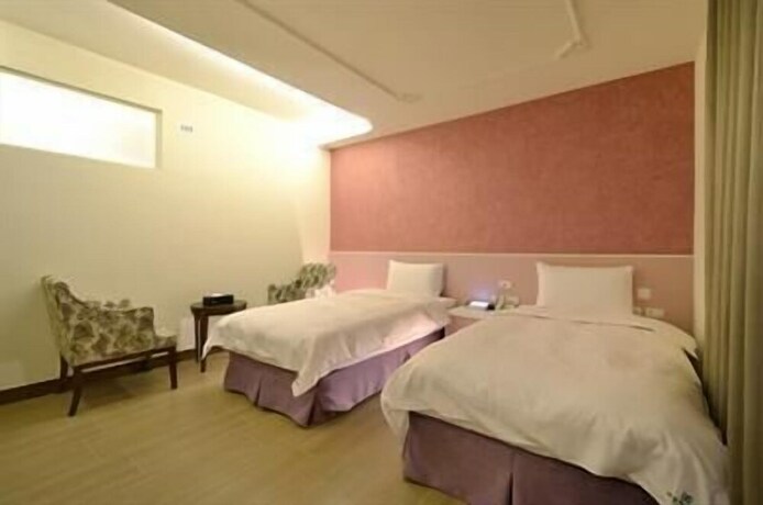 Imagen de la habitación del Hotel Zhaody. Foto 17