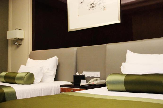 Imagen de la habitación del Hotel Zhejiang Hotel. Foto 5