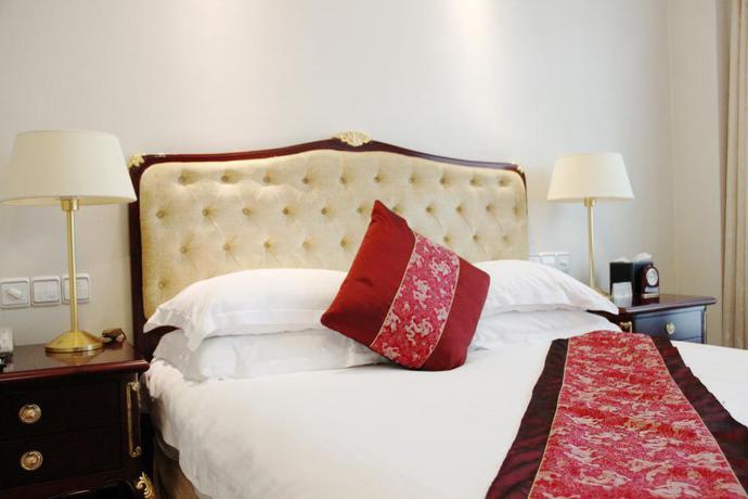 Imagen de la habitación del Hotel Zhejiang Hotel. Foto 7