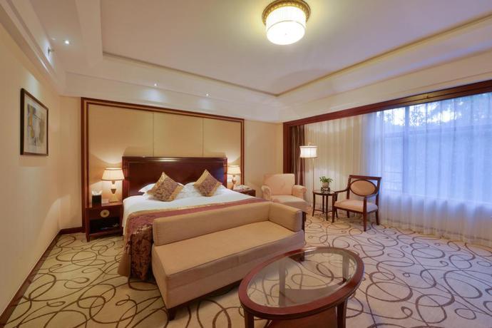 Imagen de la habitación del Hotel Zhejiang Hotel. Foto 9
