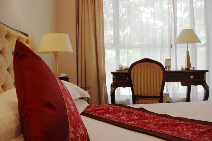 Imagen de la habitación del Hotel Zhejiang Hotel. Foto 10