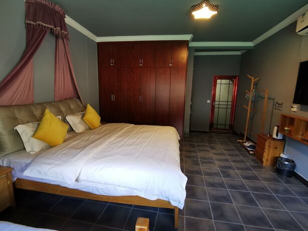 Imagen de la habitación del Hotel Zhenyuan Qiemanman Kezhan. Foto 8