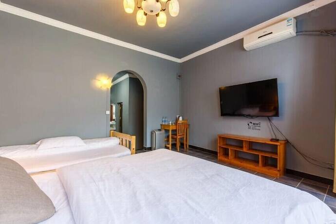 Imagen de la habitación del Hotel Zhenyuan Qiemanman Kezhan. Foto 13